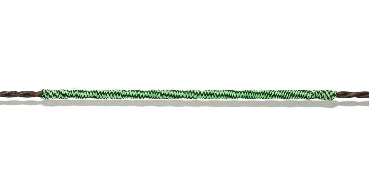Close-up of a bowstring with a green centre serving wrapped over the darker string strands