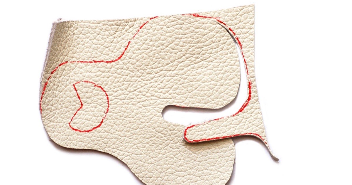 Cut leather finger tab of the kind used to protect the fingers when drawing a bowstring