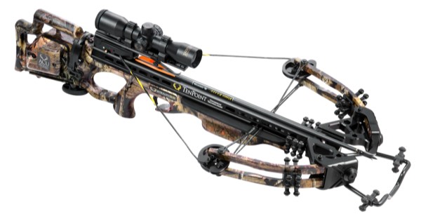 A modern compound crossbow with scope, cams and camouflage stock on a white background